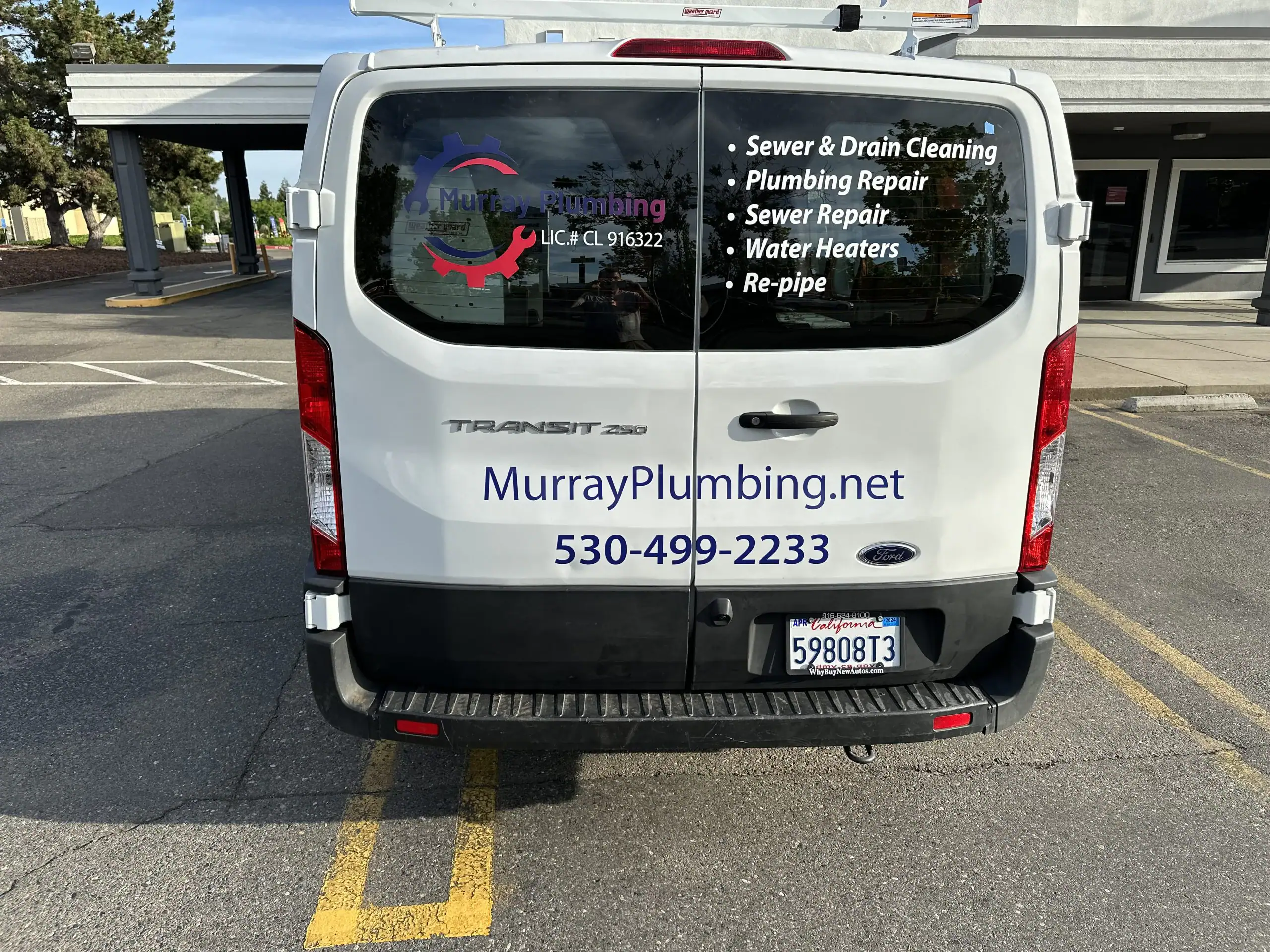 A white Ford Transit van displays "MurrayPlumbing.net," phone number 530-499-2233, and offers plumbing services like sewer cleaning, water heater replacement El Dorado County, plumbing repair, sewer repair, and re-pipe work.