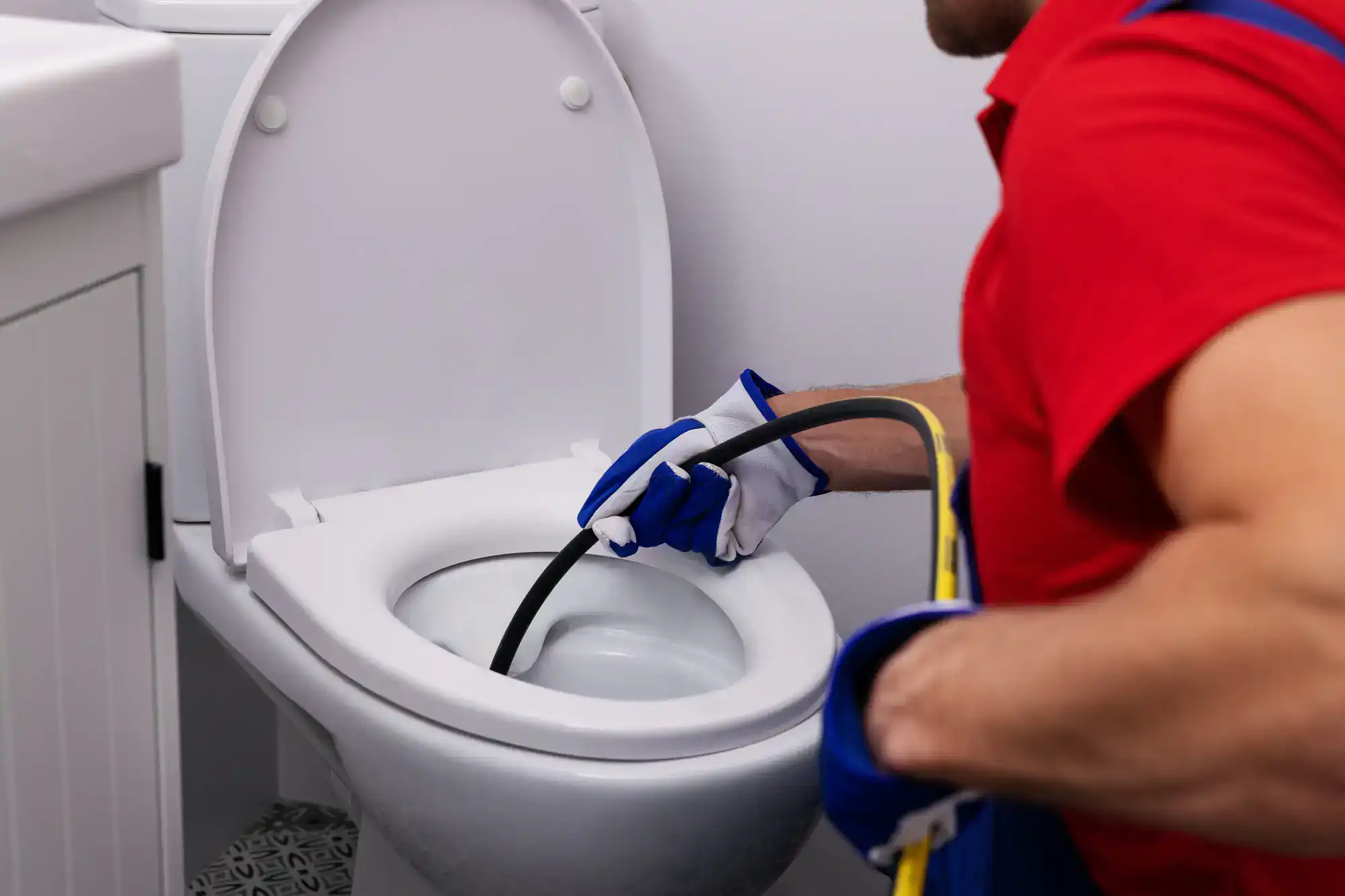 Toilet repair in progress in El Dorado County, California, with a skilled technician from Murray Plumbing fixing a residential toilet to ensure optimal performance and functionality