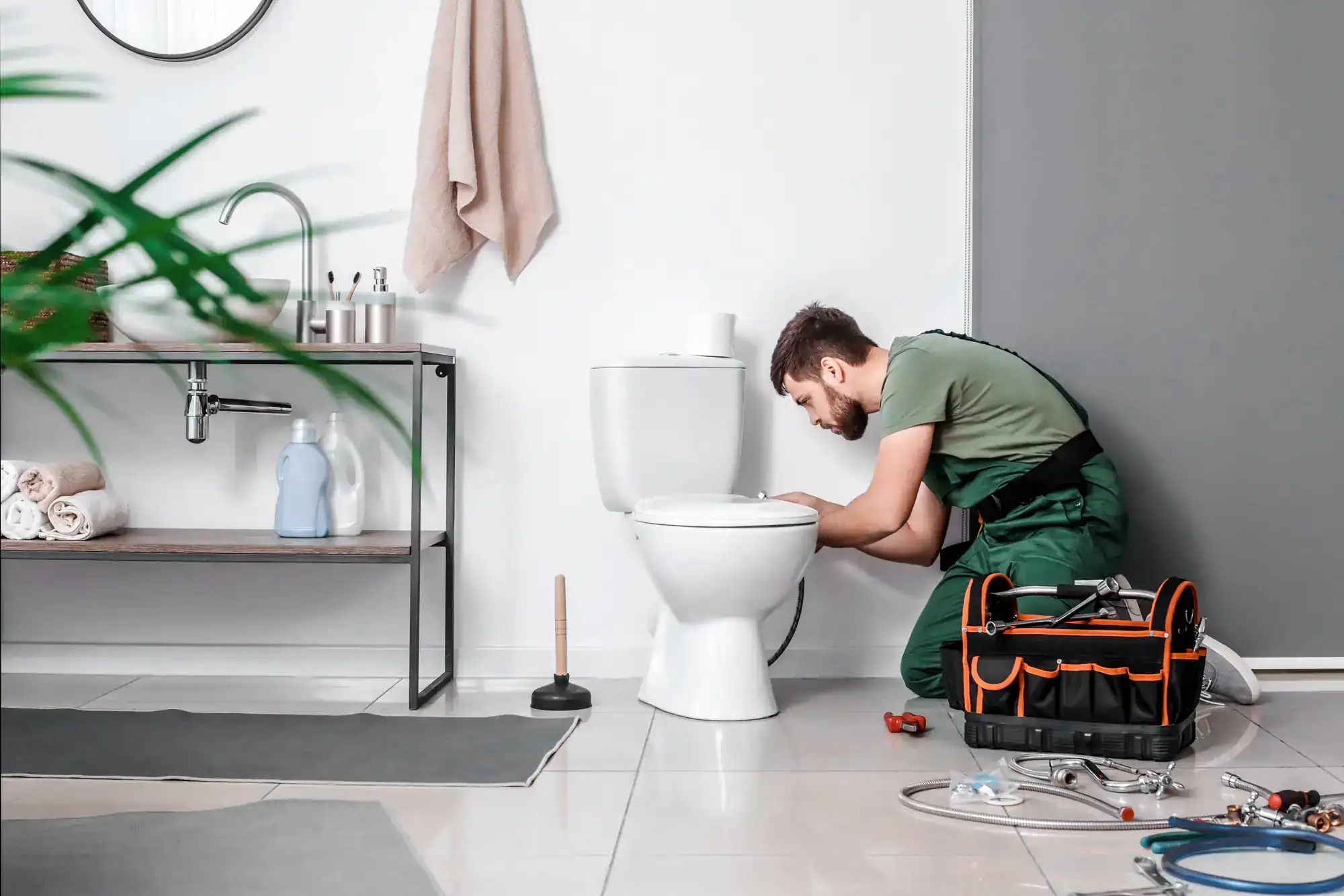 Murray Plumbing technician diagnosing and repairing a toilet issue in a home in El Dorado County, California, providing expert plumbing solutions