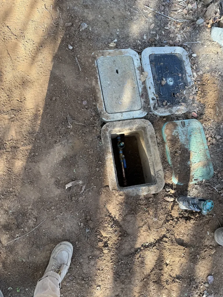 The water service boxes and excavated work area.