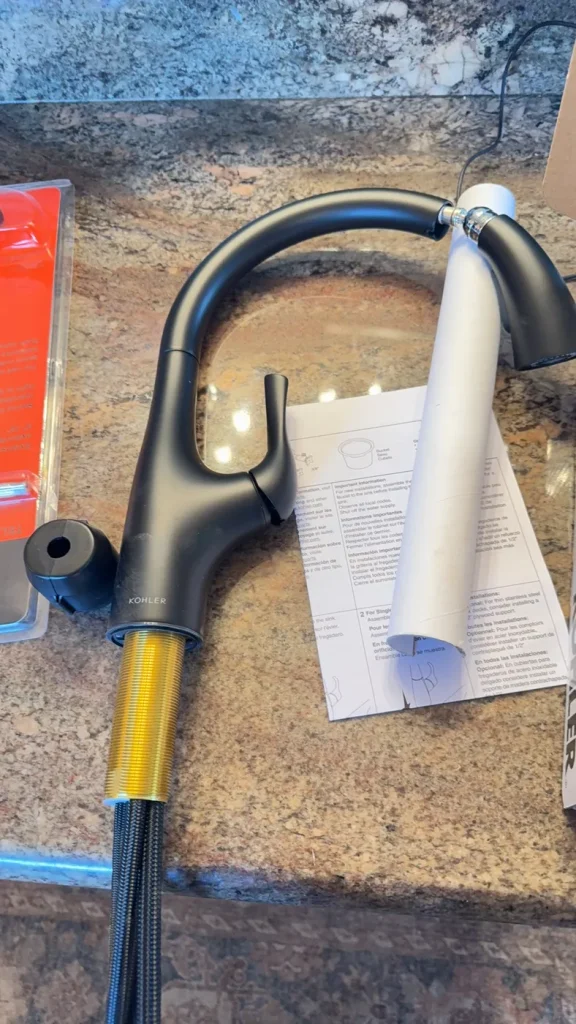 The customer-supplied kitchen faucet photographed on the counter.
