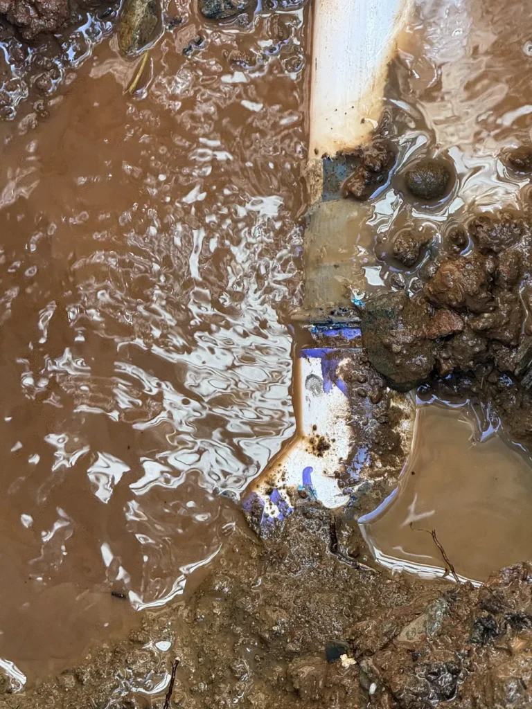 The excavated water main work area.