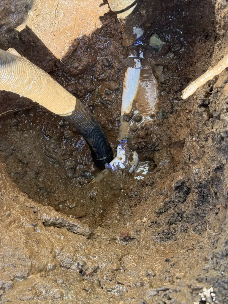 A view into the excavation around the water line.