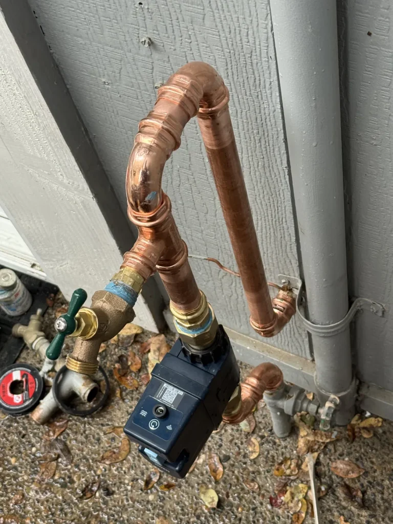 A closer view of the Moen detector and pipe connections.