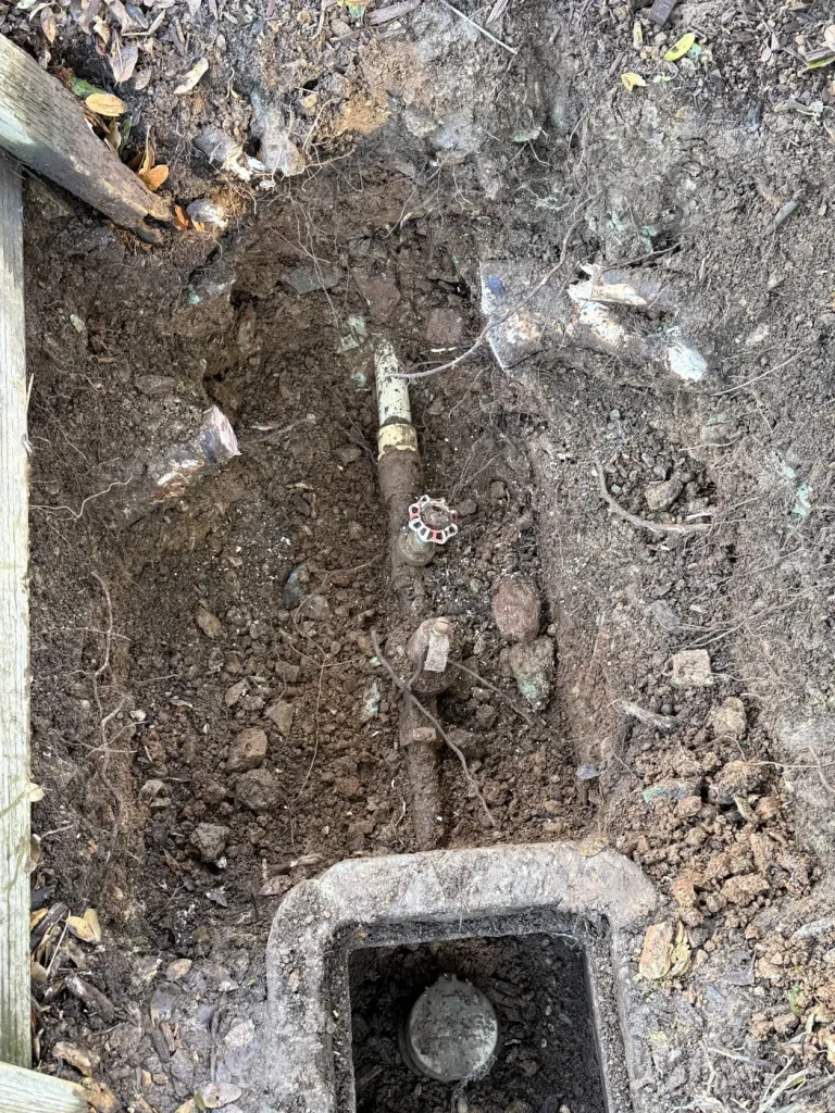 The excavated water-line work area.
