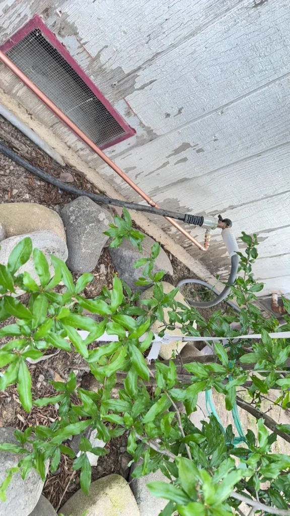 The exterior pipe route for the relocated hose bib.