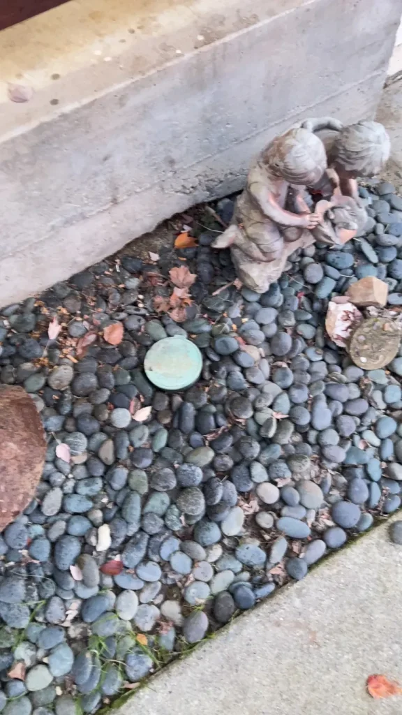 The exterior sewer access area photographed during the inspection visit.