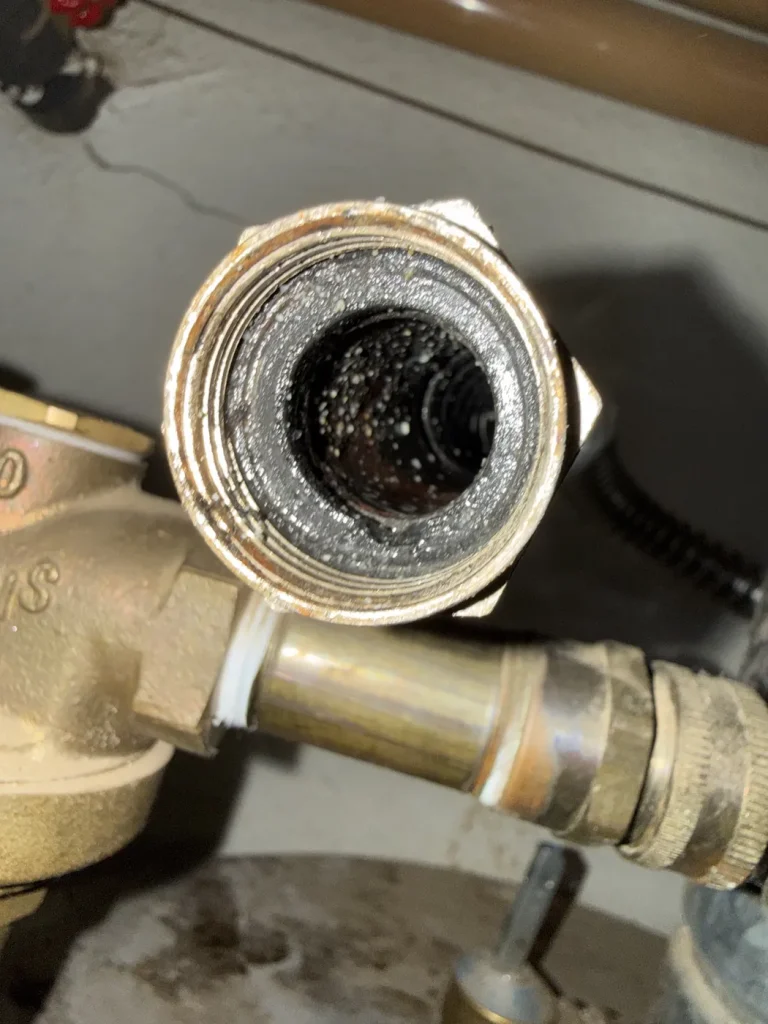 A close view of the plumbing component removed during the repair.