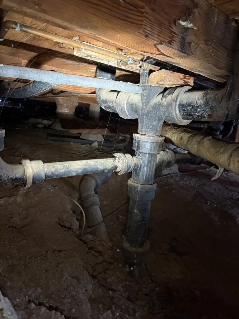 A close view of the drain connection in the work area.