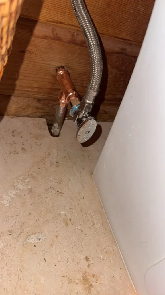 The toilet supply connection and shutoff valve documented on the job.