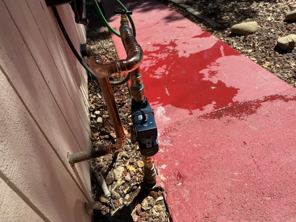 The exterior water-line area documented during the installation.