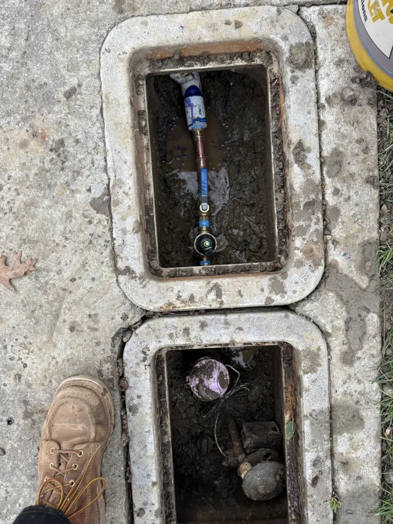 The regulator and valve assembly in the recycled-water box.