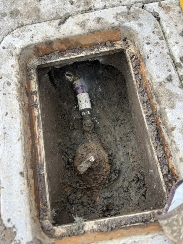 The exposed box and pipework documented during the repair.