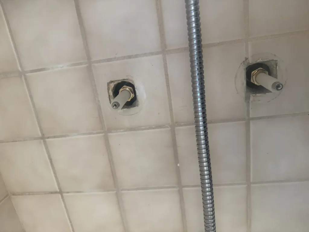 The shower controls with trim removed.
