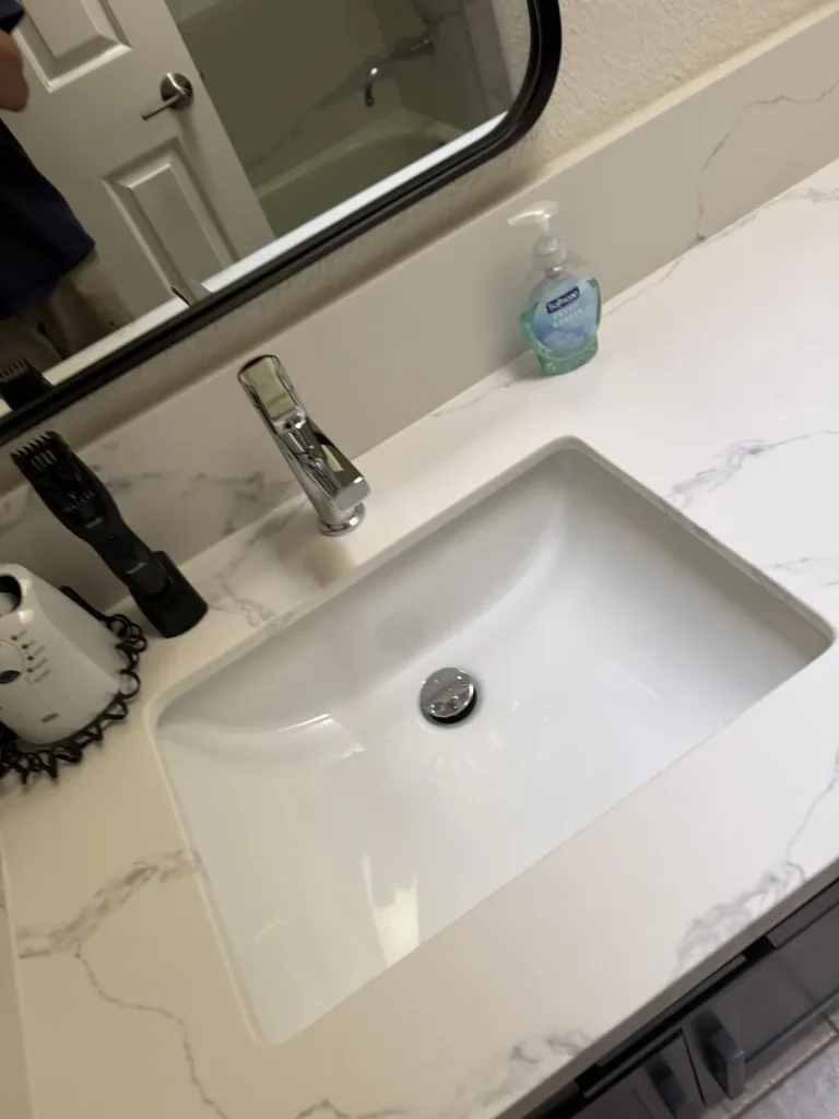 A closer view of the bathroom sink and faucet.