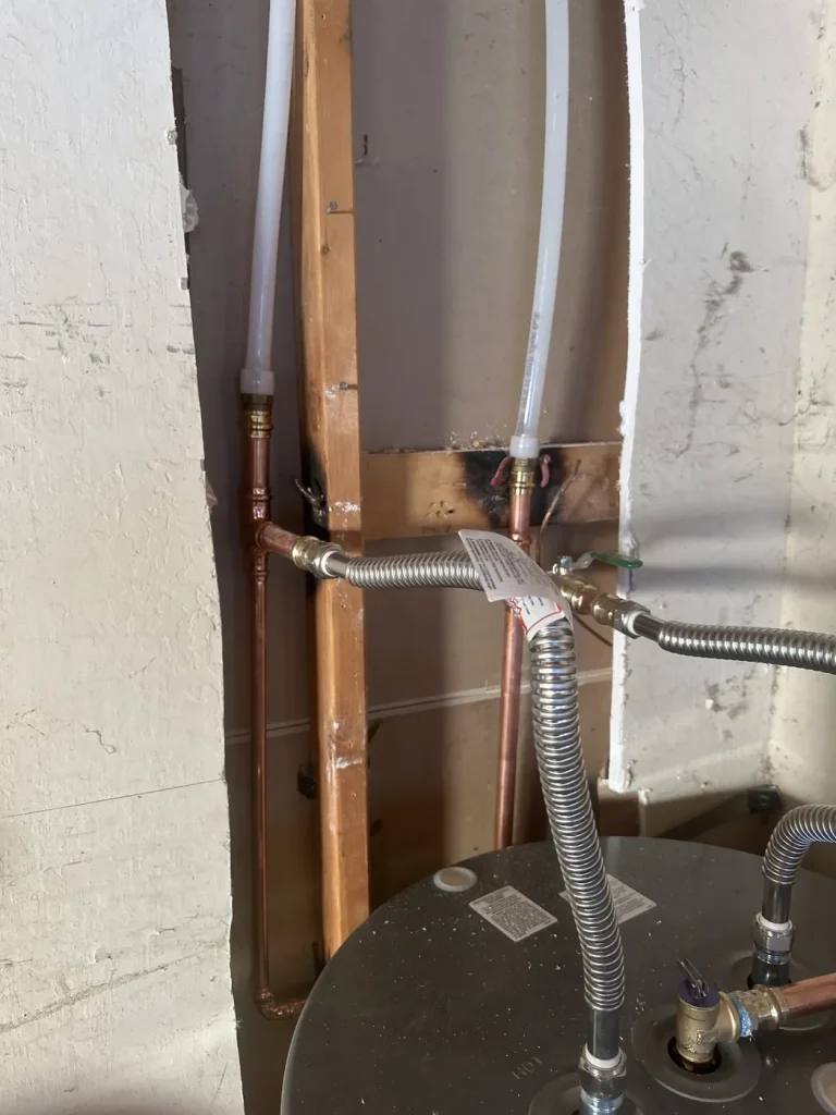 The supply pipe connections at the bathroom fixture.
